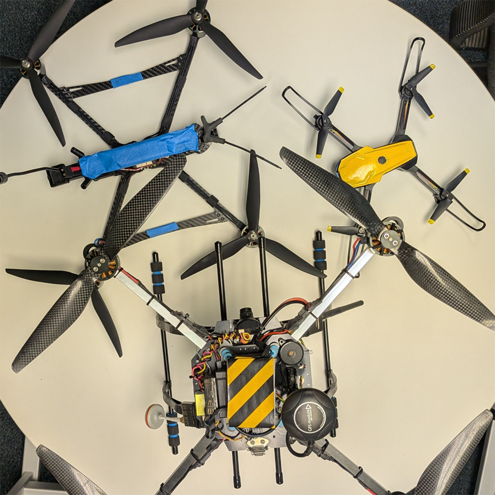 Table full of Drones, Agape-1 AI Robot